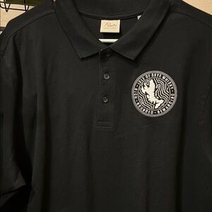 XXL men’s polo style black shirt with embroidered emblem.